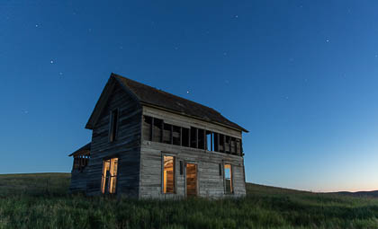 A farmhouse is washed in twilight on Tuesday