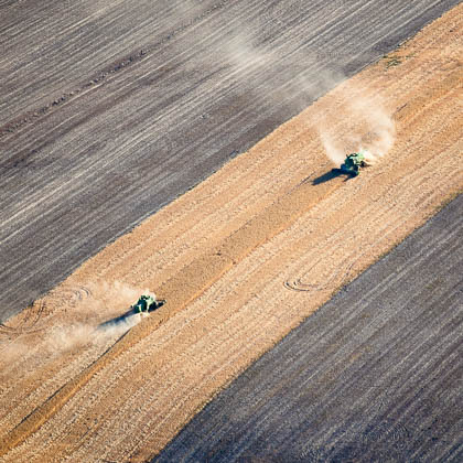 Two combines harvest a wheat field in the Palouse region of Washington State on Friday